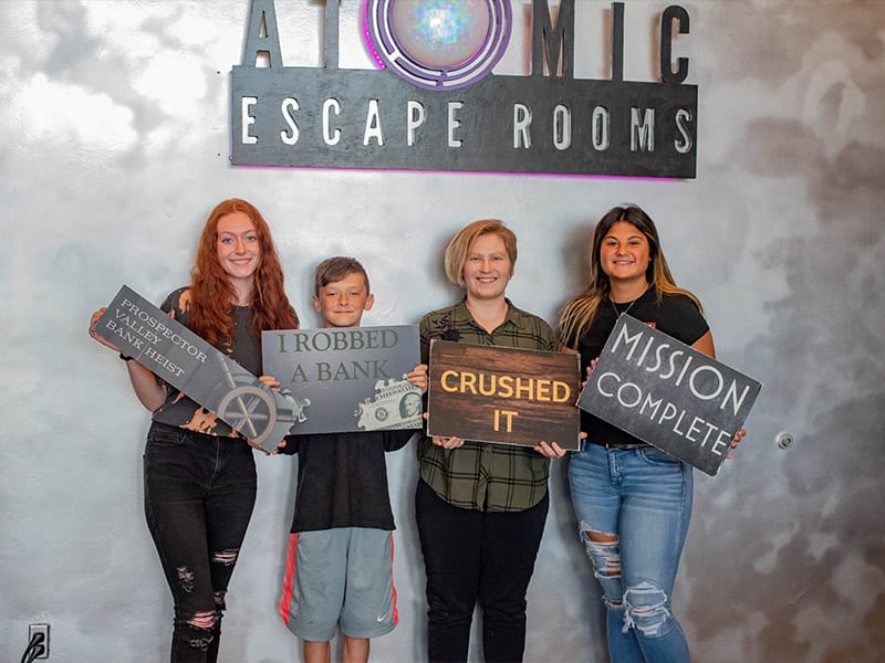 large group photo outside escape room